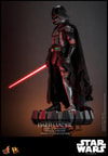 Left side view of Darth Vader™ (Battle Damaged) in full suit, displayed on a base, holding a lightsaber in his right hand with his mechno left arm at his side. (Prototype Shown) View 17