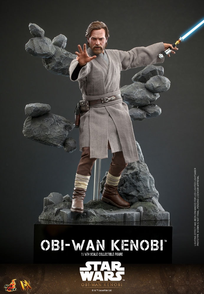 Full-body shot of Obi-Wan Kenobi on a rocky diorama base, recreating his showdown with Darth Vader, using the Force with his right hand while holding his lightsaber in his left.- Prototype Shown View 5