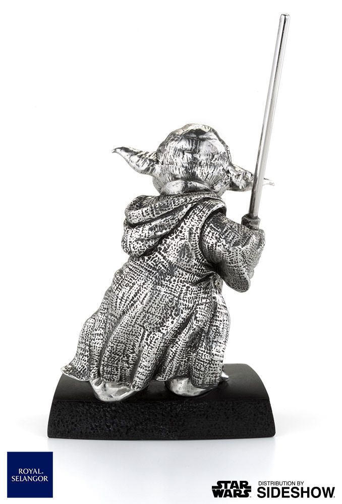 star wars yoda figurine with book of wisdom